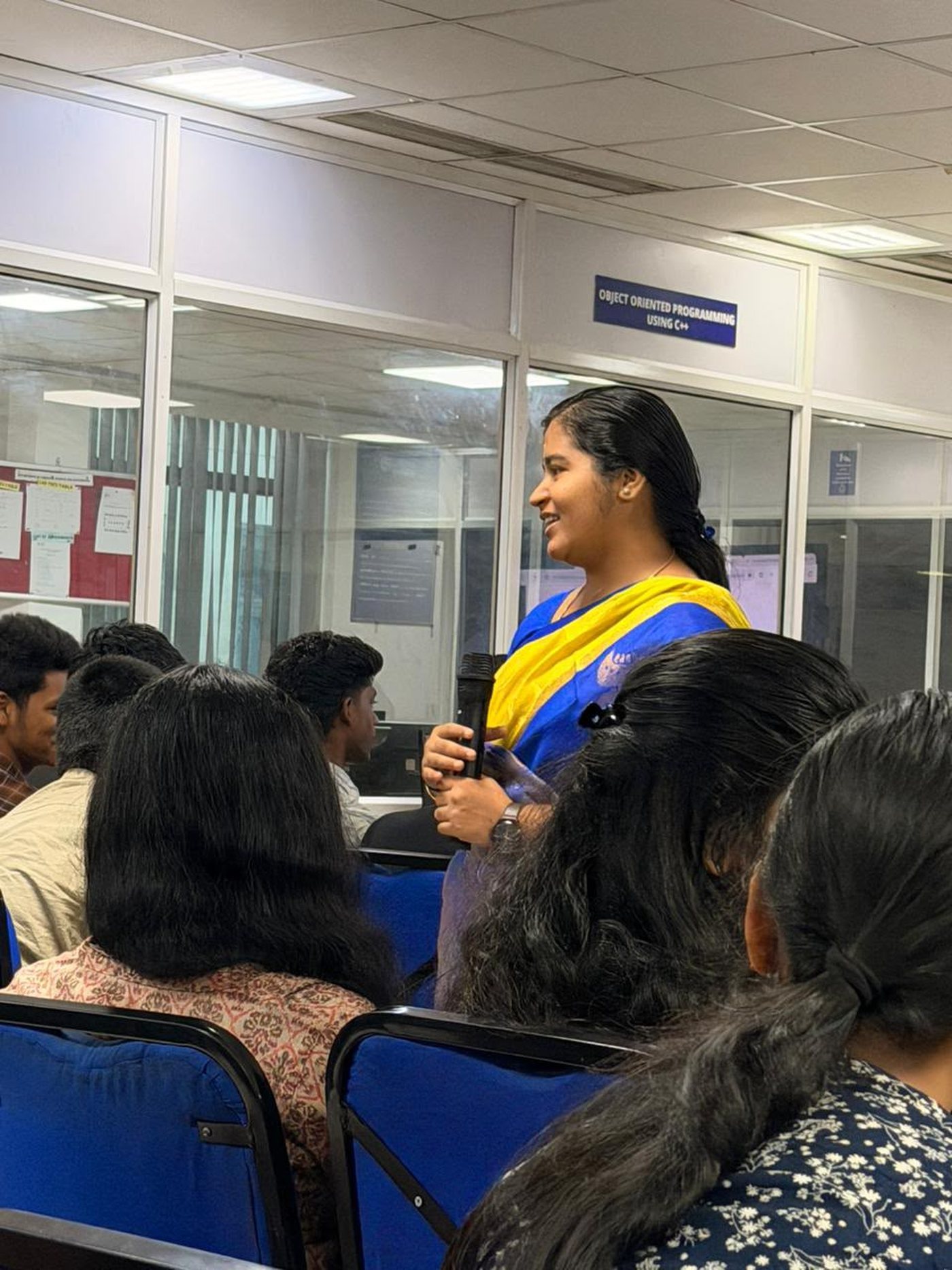 Ms. Ranjitha R taking questions from the room
